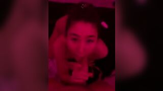 Slutty Asian Gf Sucking His Hard Cock in a Red Room Video