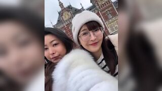 Asian Cutie With Her Friend Giving a Kiss On Cam Video