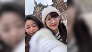 Asian Cutie With Her Friend Giving a Kiss On Cam Video