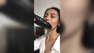 Asian Teen Sucking a Huge Black Dildo Video