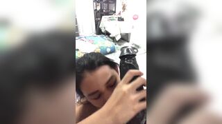 Cute Asian Teen Sucking a Huge Black Dildo On Cam Video