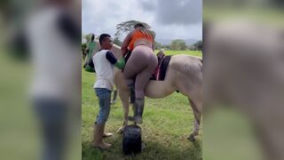 Big Booty Babe In Tights Riding a Horse Video