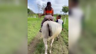 Big Booty Babe In Tights Riding a Horse Video