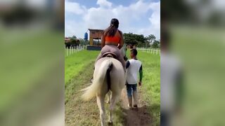 Big Booty Babe In Tights Riding a Horse Video
