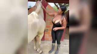 SteffyQuiroz2 Busty Babe Showing Off Her Big Titties While Brushing a Horse Video