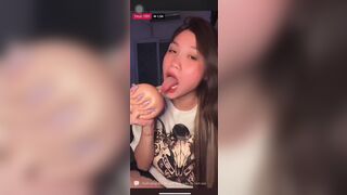 Asian Slut Sucking Dildo and Licking Toys on Live Video