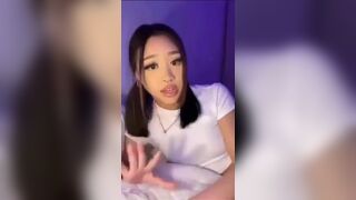 Horny Asian Sucking and Teasing Her Pussy With a DIldo Video