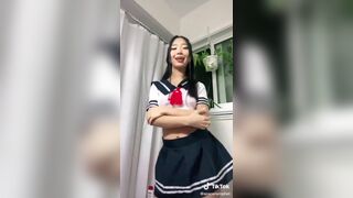 Asian Slut in a School Skirt Flashing Boobs Tiktok Video