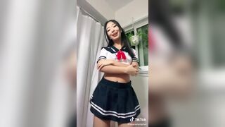Asian Slut in a School Skirt Flashing Boobs Tiktok Video
